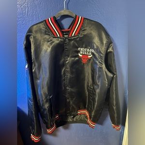 Chicago Bulls varsity jacket in black with logo.
